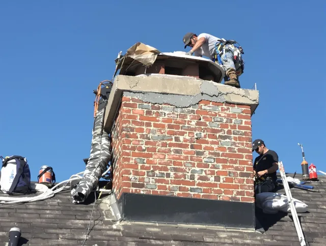 Deltona Chimney Sweep installing a custom chimney crown in Deltona, FL