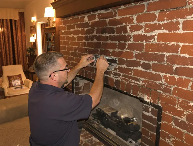 Deltona Chimney Sweep expert fixing a fireplace in Deltona, FL